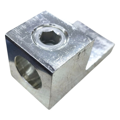 Metal block with hexagonal hole on a white background