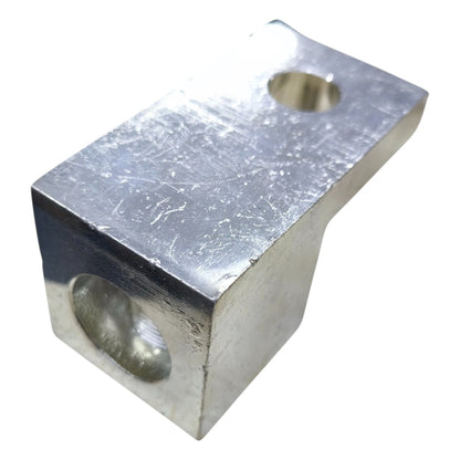 Metal block with two holes on a white background
