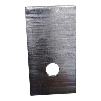 Rectangular metal plate with a central hole on a white background
