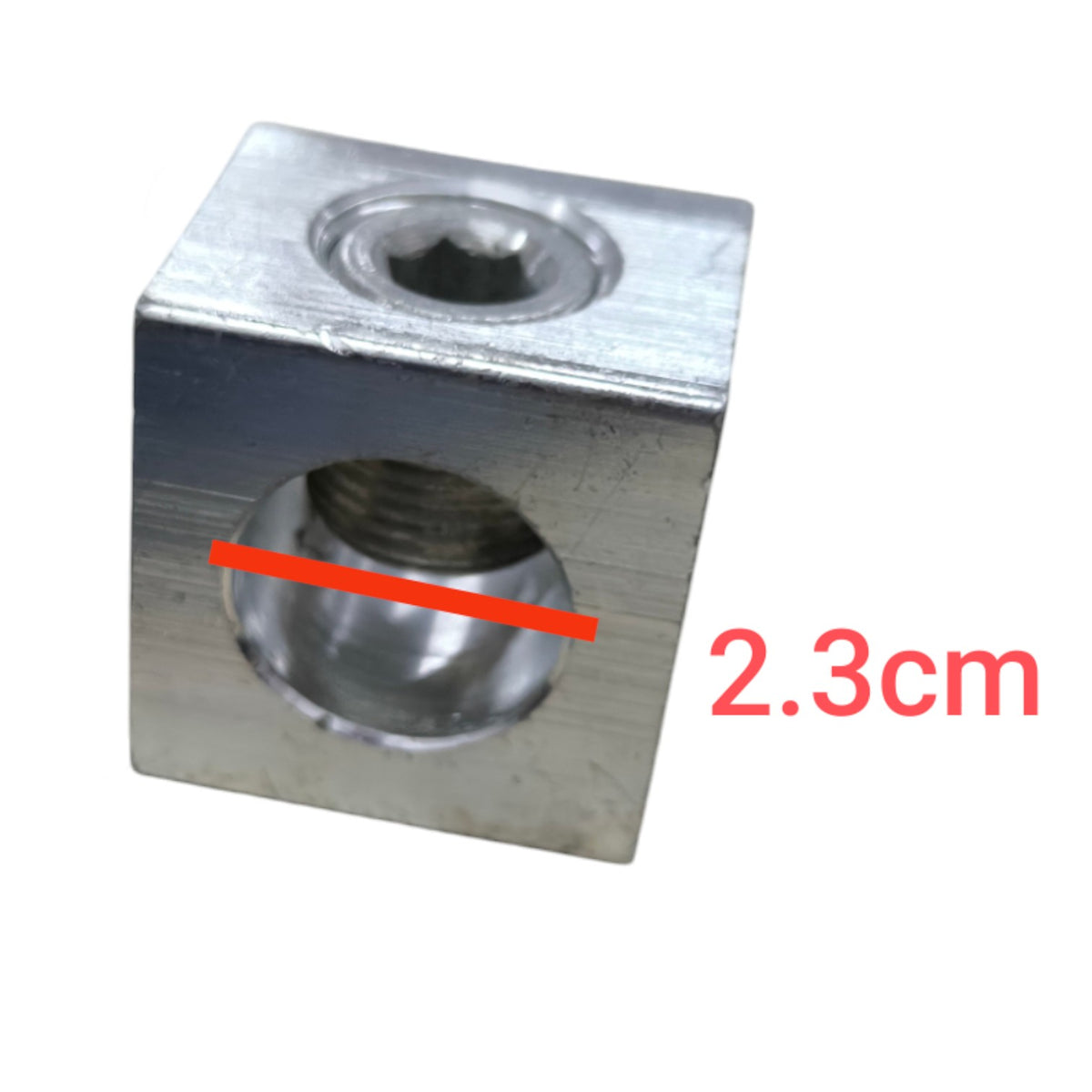 Metal block with threaded holes and a measurement of 2.3cm on a white background