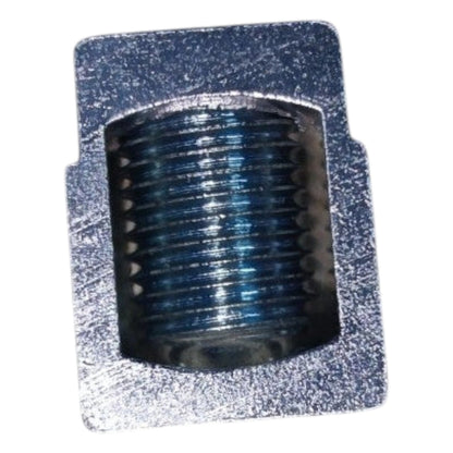 Metallic cylindrical object on a textured gray background