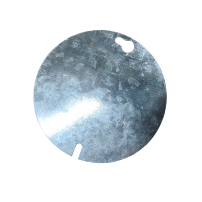 Round metallic object with a central cutout on a white background