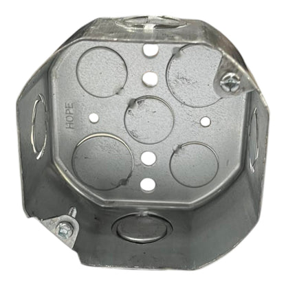 A galvanized steel electrical junction box with a hexagonal shape, featuring pre-drilled screw holes and circular terminal holes on the interior, with the brand name HOPE stamped on one side.