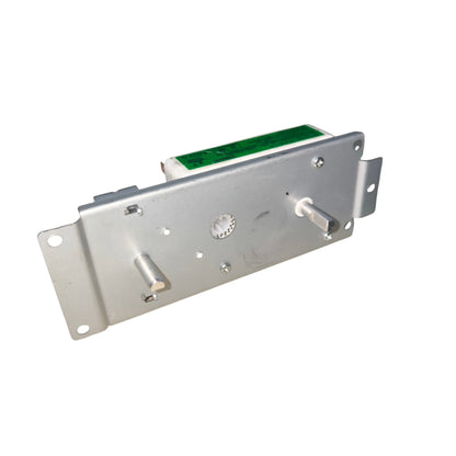 Metallic electronic component with green label on a white background