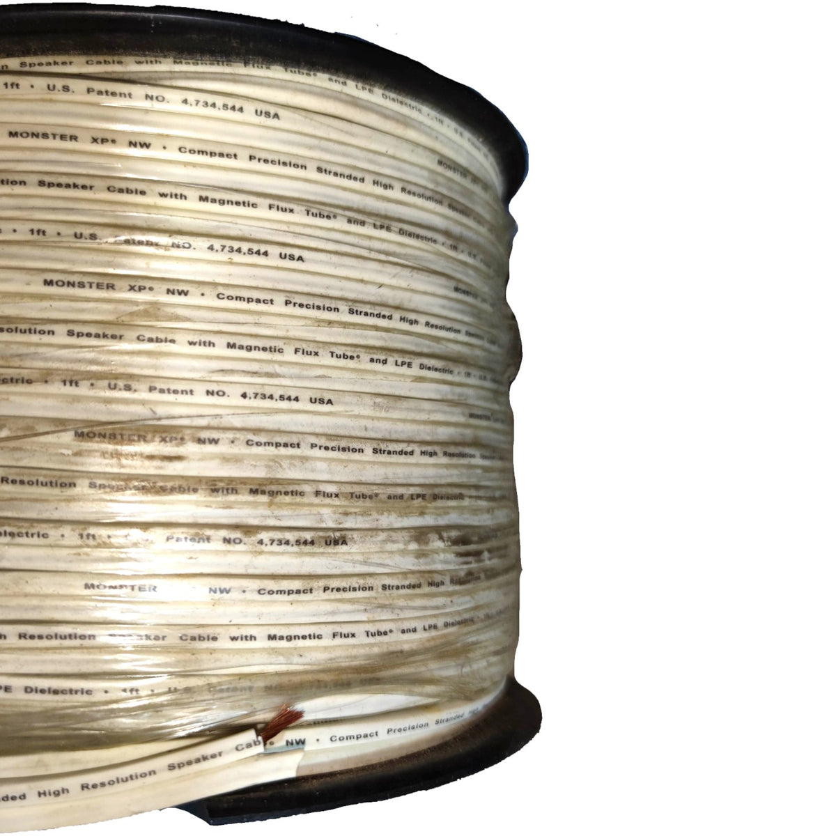A large spool of Monster KFX-NSW compact precision braided high resolution speaker cable, shown on a plain white background.