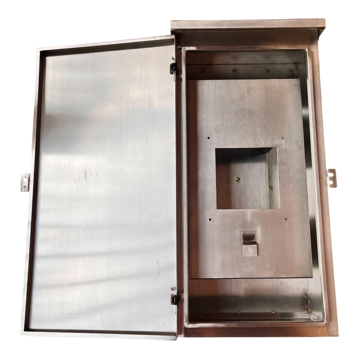 A brushed stainless steel electrical or utility cabinet shown open, with the door swung to the left and the interior mounting plate visible against a plain white background.