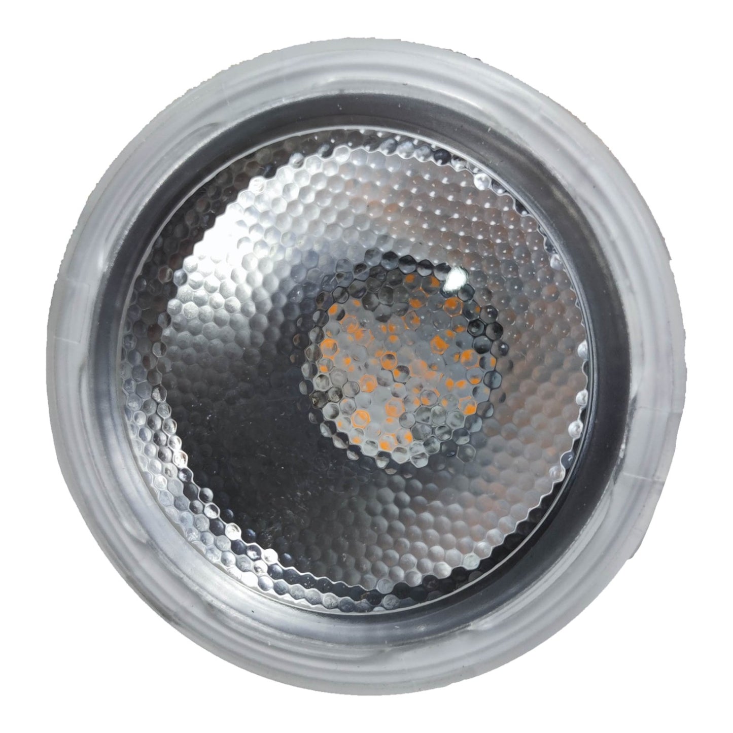 Close-up of a metallic light bulb with a textured surface on a white background