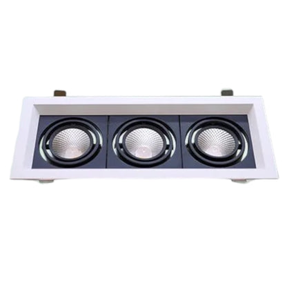 A three-light recessed ceiling fixture with a white outer frame and black inner panels, each light housing a circular reflector.