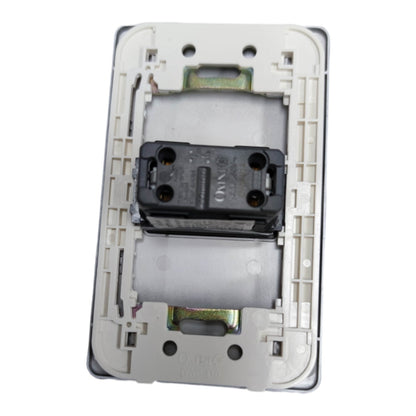 A replacement electrical switch module showing the back side with a black central contact block, silver metal contacts, and a beige plastic backplate on a white background.