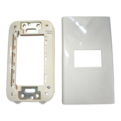 A white glossy rectangular wall plate cover with a central rectangular cutout, shown next to a cream-colored plastic mounting frame insert on a white background.