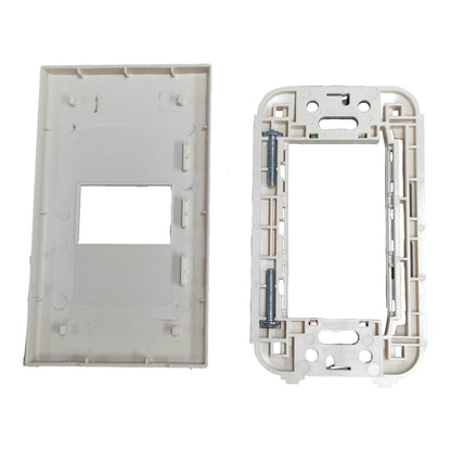 A pair of white plastic electrical switchboard tray components, showing the front plate on the left and the back frame with mounting holes and screws on the right, set against a plain white background.