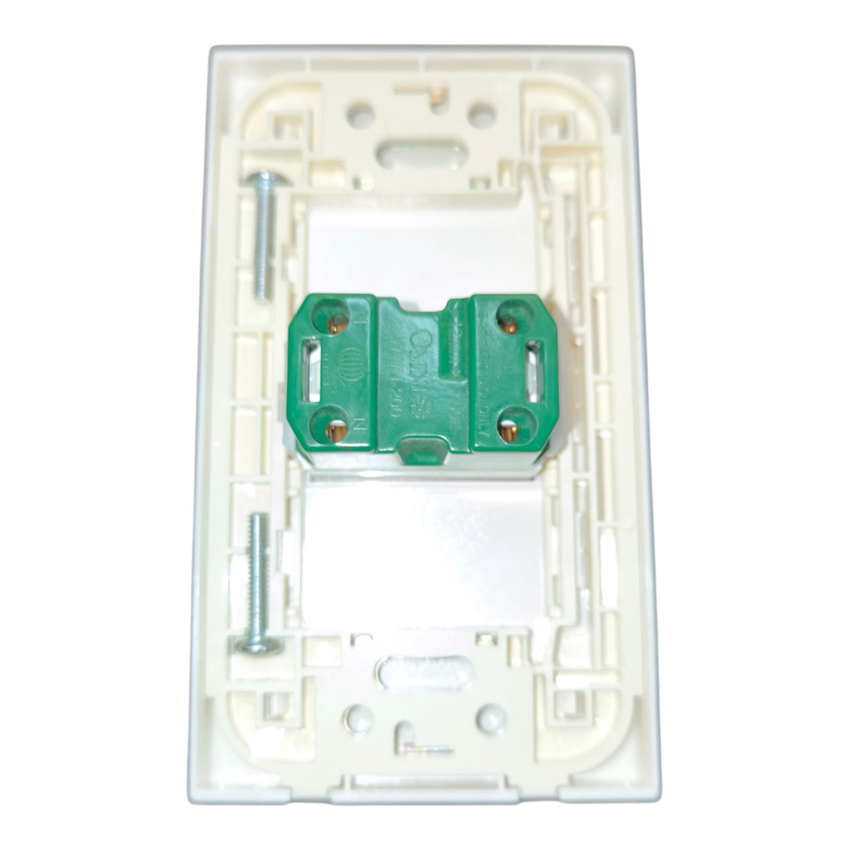 A white plastic electrical switch plate backplate with a green terminal block and mounting screws, shown on a plain white background.
