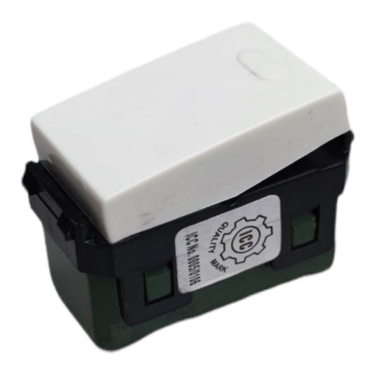 A small electrical switch component with a white top cover, black side housing, and a dark green base, shown on a plain white background. A white label is attached to the side.