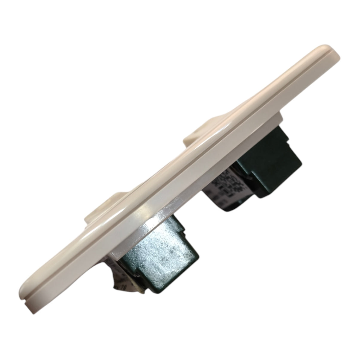 A replacement light switch module with a beige plastic faceplate and dark metal and green internal components, shown on a plain white background.
