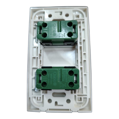 An off-white plastic double-gang switch plate showing the back side with two green terminal blocks for wiring, branded ONS.