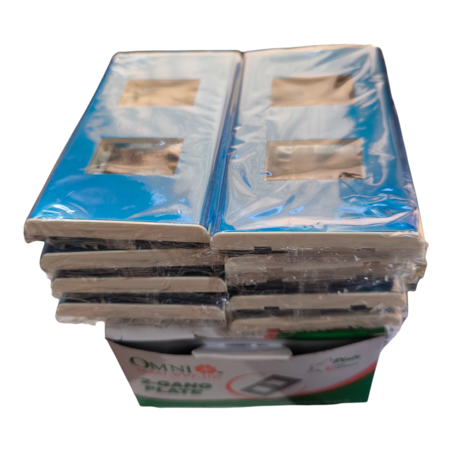 A stack of Omni 2-in-1 wall plates wrapped in clear plastic, showing the blue and gray front faces and the cardboard backing.