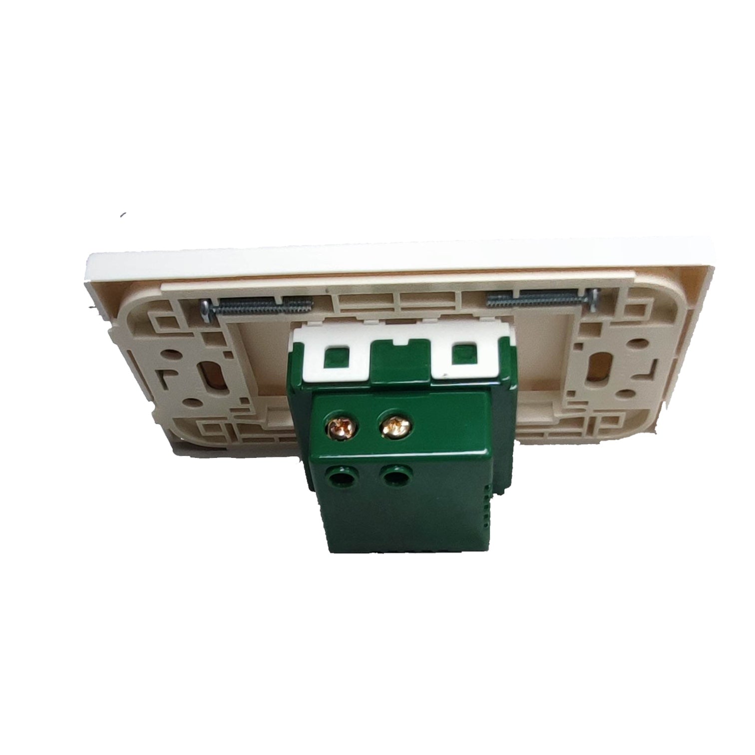 A rear view of a white recessed ceiling light switch plate with a green terminal box and white screw terminals, shown against a plain white background.
