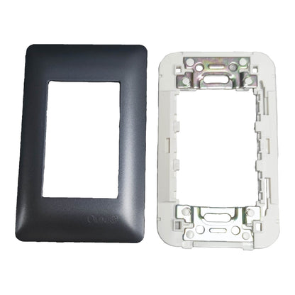 A black faceplate cover and a white backplate insert for a double-gang switch or outlet, displayed side-by-side on a white background.
