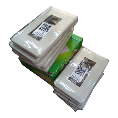Three stacks of clear plastic-wrapped square inserts or cards with QR code labels, arranged on top of a green box against a plain white background.