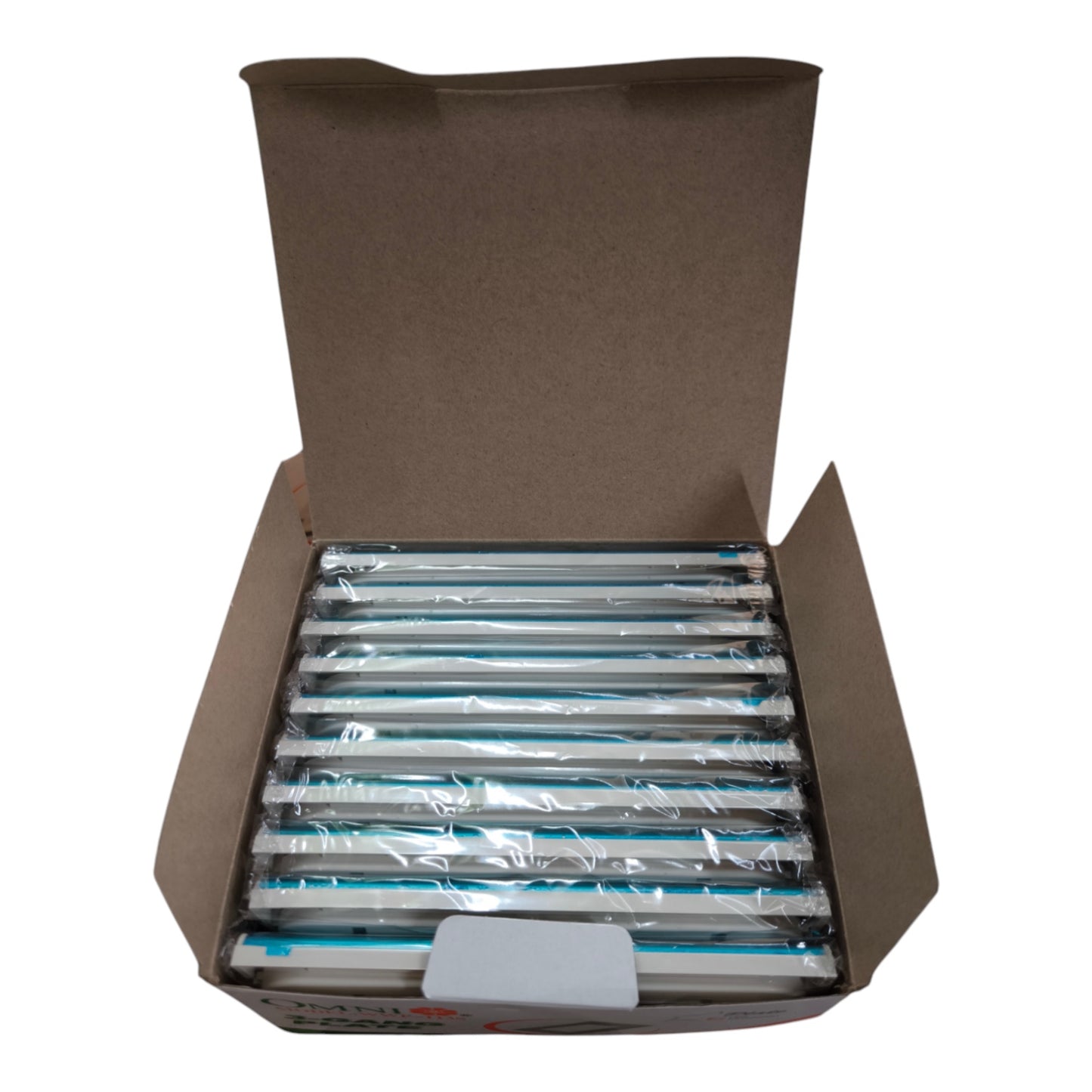 An open brown cardboard box containing multiple packaged cylindrical items wrapped in clear plastic, arranged horizontally on a white background.