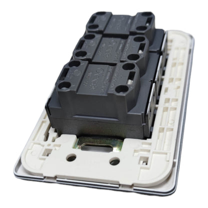 A close-up of a black electrical contact block mounted on a white plastic backplate, photographed on a plain white background.