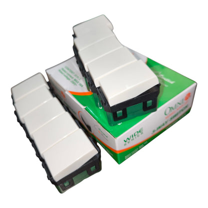 White and black plastic bus-shaped plastic toys with a green and white retail box, shown on a plain white background.
