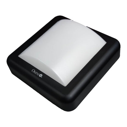 A square black outdoor light fixture with a curved white diffuser, shown at an angle on a white background. The brand name 'OMNI' is visible on the side.