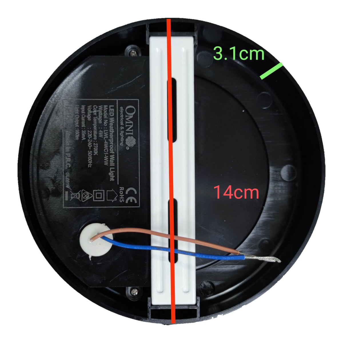 Top-down view of a circular black LED motion sensor wall light base with dimension annotations showing 14cm diameter, 3.1cm depth, and a vertical center line, on a white background.