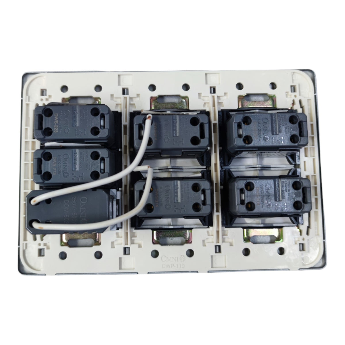 An electrical wall switch module with six black contact blocks arranged in two rows of three on a white plastic base, with two white wires connected at the top, photographed against a white background.