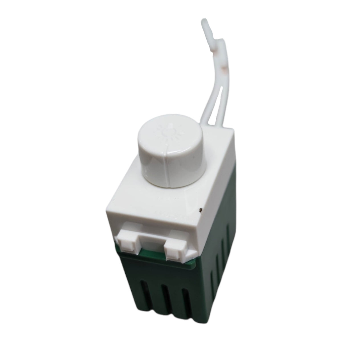 A small plastic component with a white top cap and loop, a white rectangular body, and a dark green ribbed base, shown on a plain white background.
