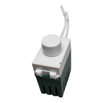 A small plastic component with a white top cap and loop, a white rectangular body, and a dark green ribbed base, shown on a plain white background.