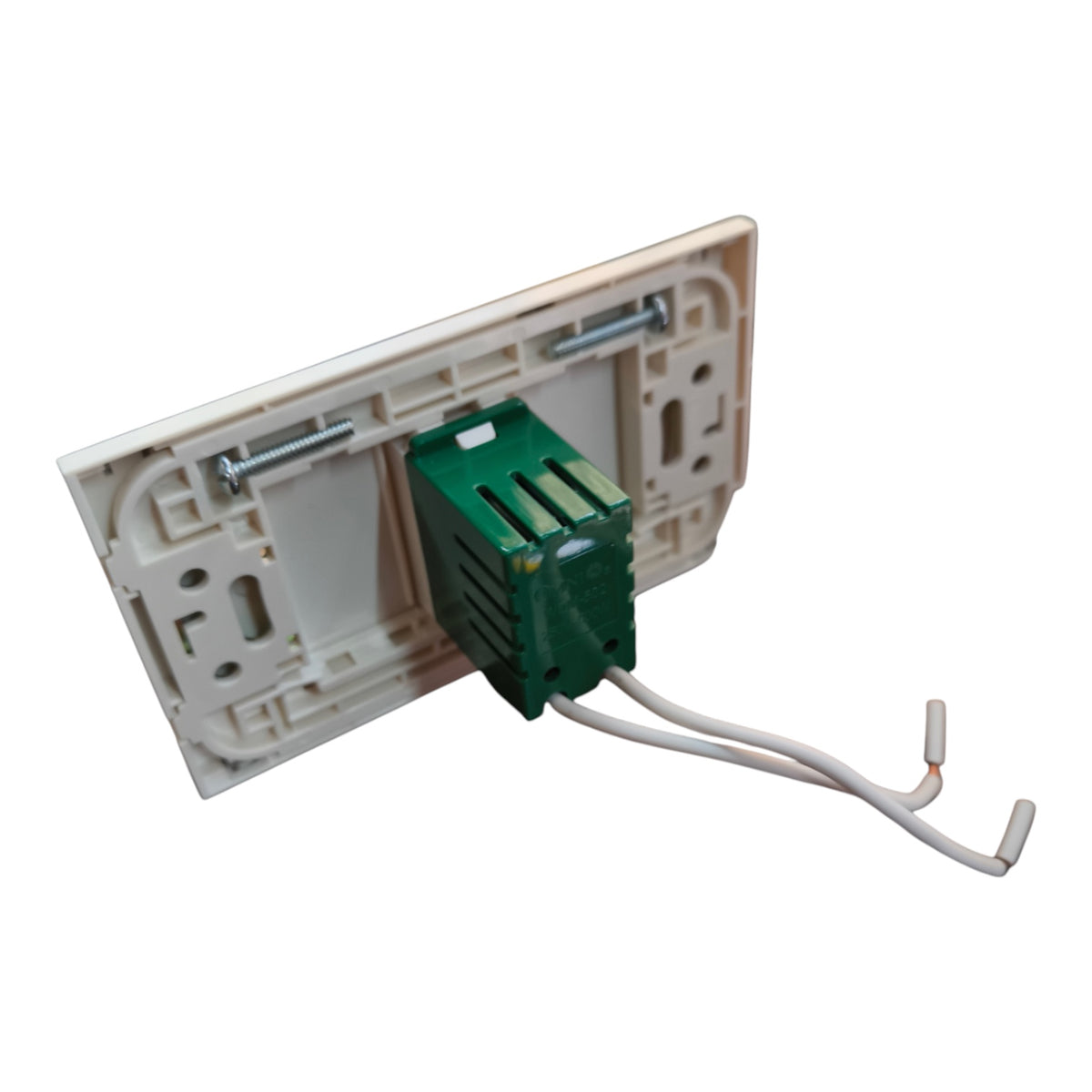An electrical switch plate backplate assembly in cream plastic, showing the mounting holes, a green terminal block connector, and two white wire leads on a white background.