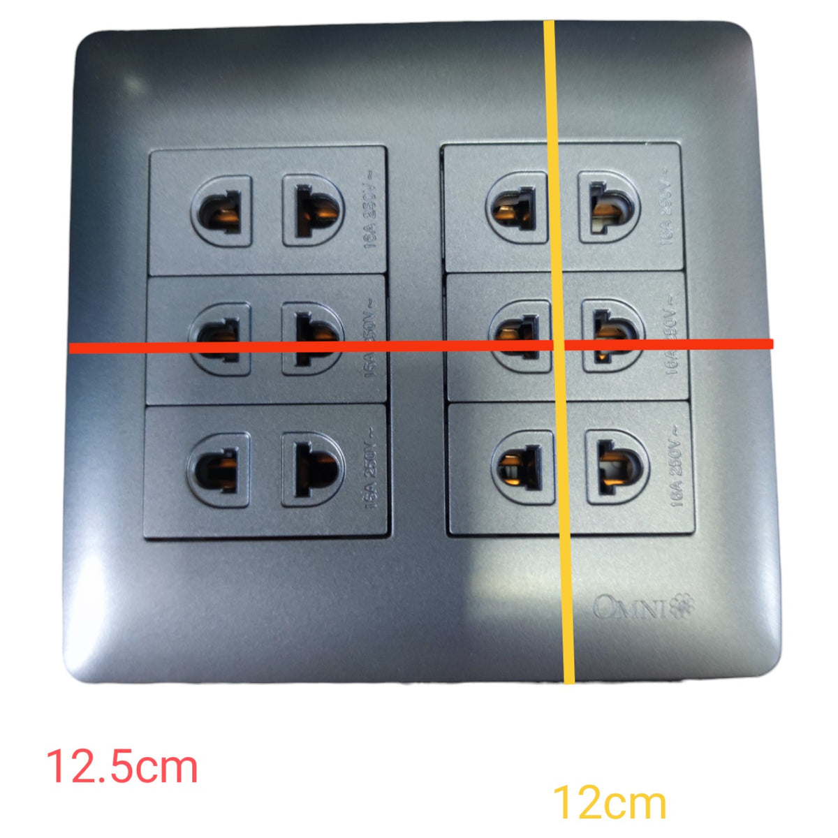A square metallic gray electrical outlet panel with six sockets, overlaid with red and yellow measurement lines and text indicating dimensions 12.5cm and 12cm on a white background.