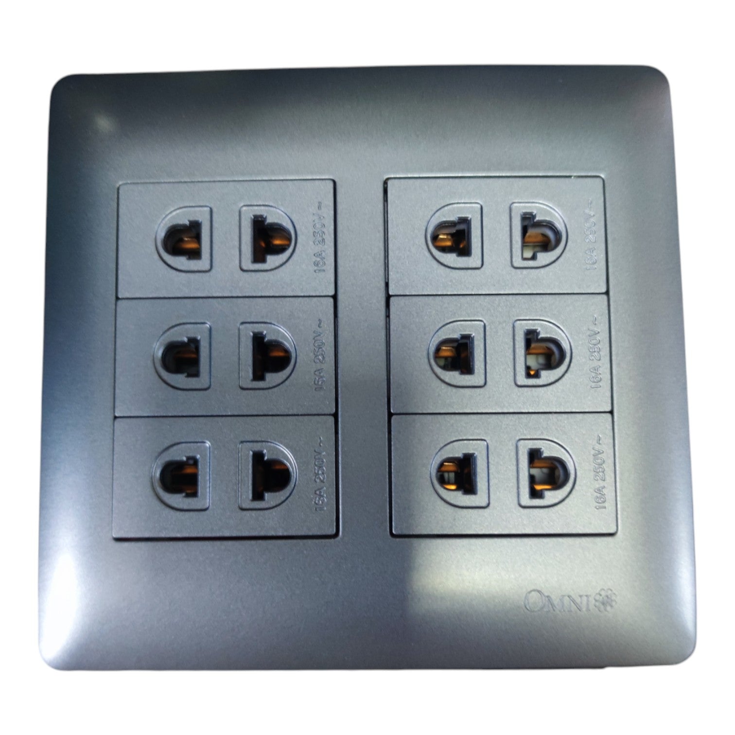 A square metallic gray electrical outlet panel with six sockets arranged in two columns of three, shown on a plain white background.