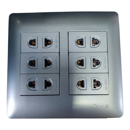 A square metallic gray electrical outlet panel with six sockets arranged in two columns of three, shown on a plain white background.