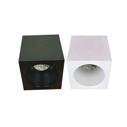 Two modern square recessed LED light fixtures shown side by side on a plain white background. The left fixture has a matte black exterior, and the right fixture has a white exterior.