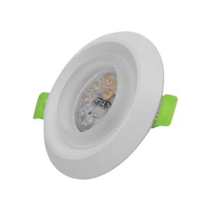 A recessed LED ceiling light with a white circular frame and bright green side brackets, shown at an angle on a plain white background.