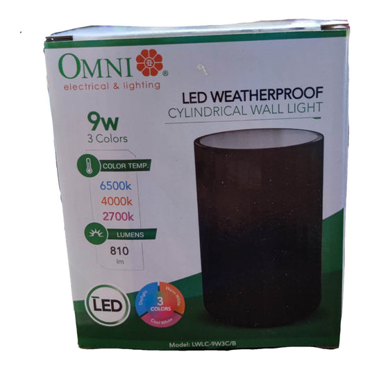 A box of an Omni Electrical & Lighting LED weatherproof cylindrical wall light, shown on a plain white background. The packaging is white with green accents and features a photo of the dark cylinder light on the front.