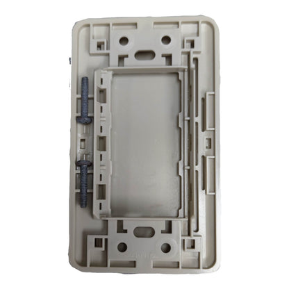 A light gray plastic modular wall switch panel or electrical junction box with mounting slots and two dark gray screws on the left side, shown on a plain white background.