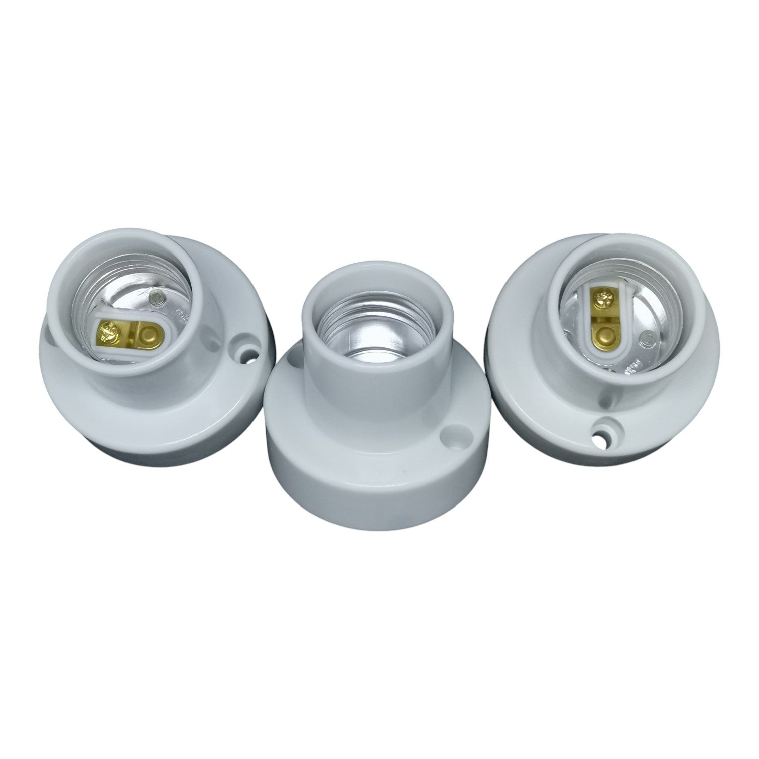 Three white light socket bases on a white background