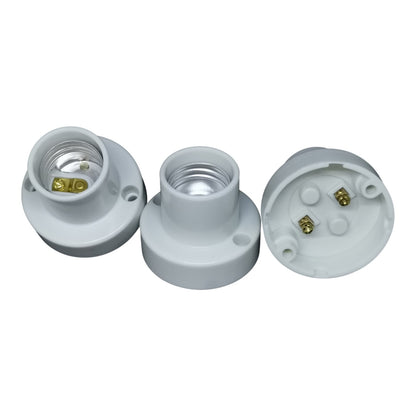 Three white light socket bases on a white background