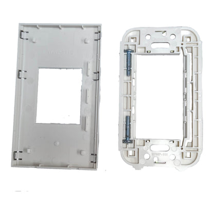 A white plastic electrical switch plate cover and matching backplate shown on a white background, with a small blue metal screw visible on the back frame.