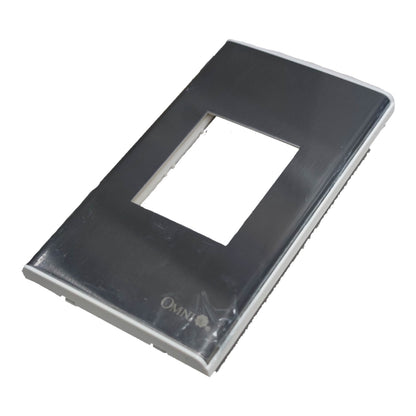 A glossy black rectangular light switch plate cover with a central square cutout, featuring the Omina brand logo near the bottom, shown on a plain white background.
