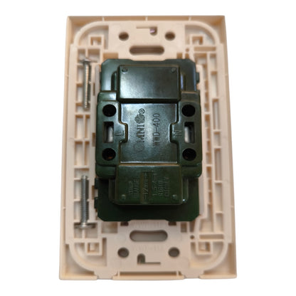 A green electrical switch contact block with screws, shown inside a beige plastic mounting tray on a white background.
