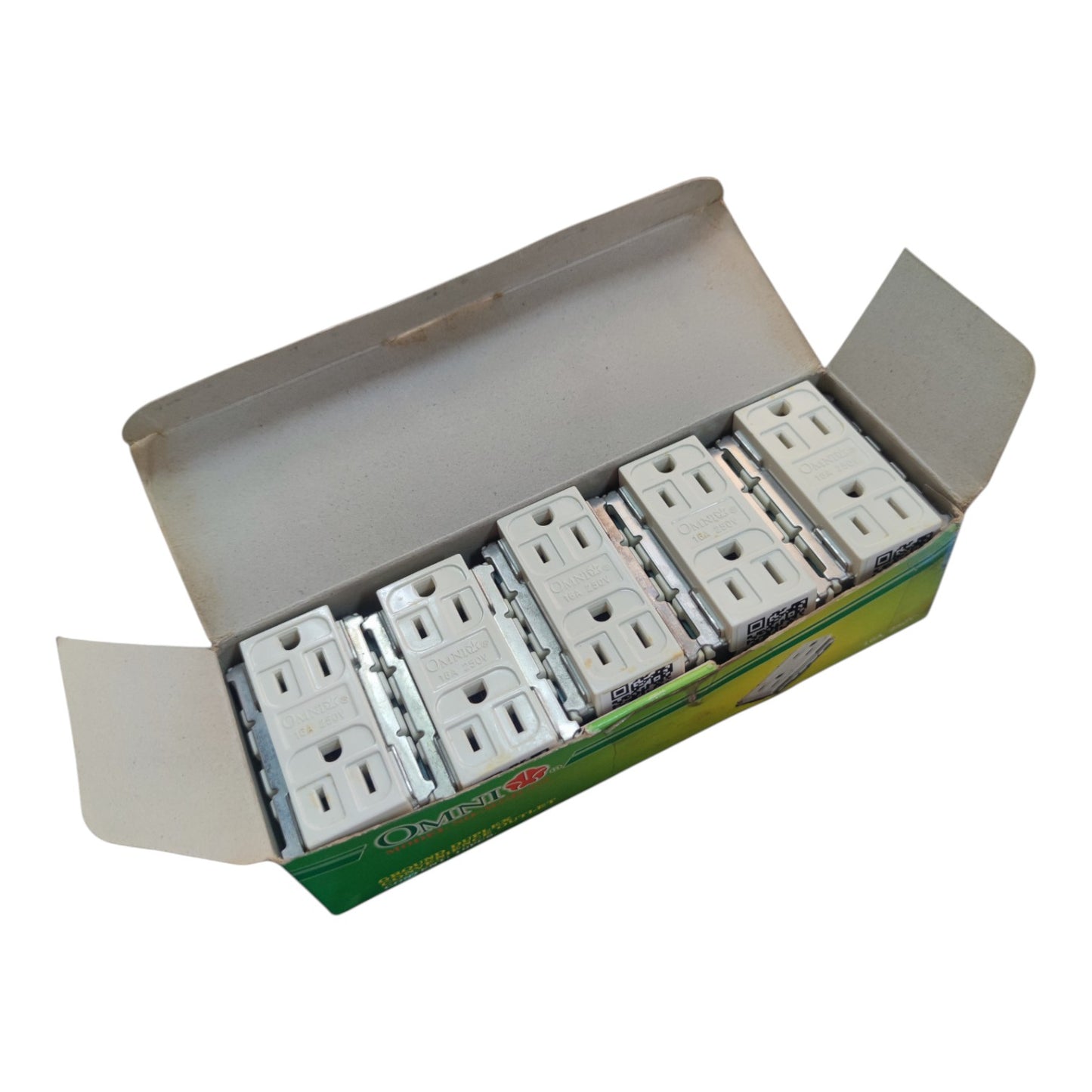 An open cardboard box containing five white electrical outlet covers, photographed on a plain white background.