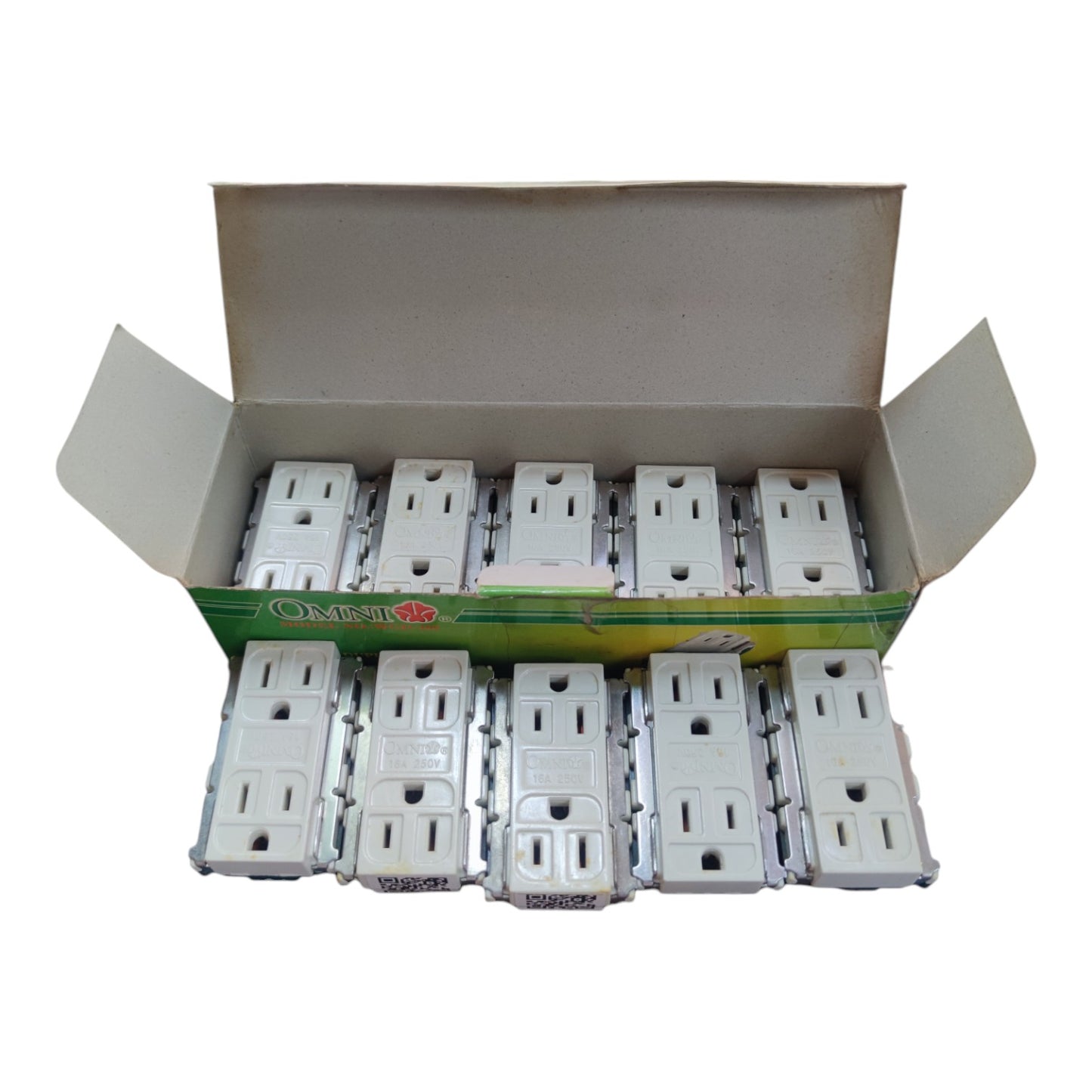 An open cardboard box containing multiple white electrical outlet covers arranged in rows, photographed on a plain white background.