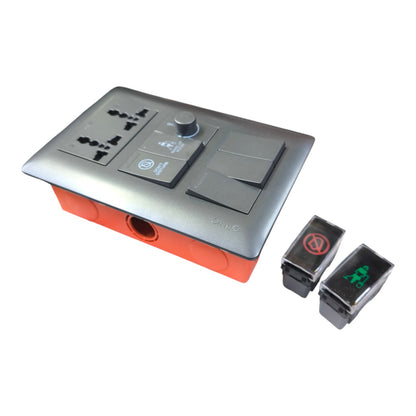 A modern dual-gang wall switch panel with a matte gray top plate, orange-red base, built-in AC outlets, a rotary dial, and two separate toggle switches shown beside it on a white background.