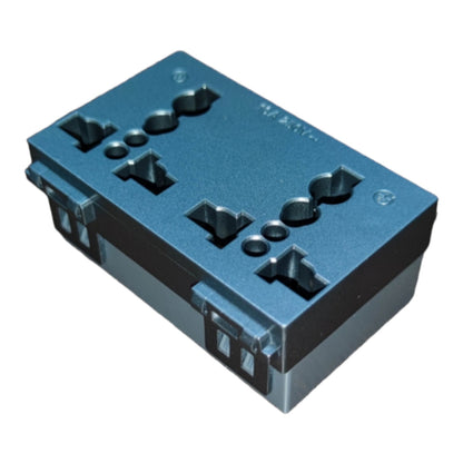 A dark blue-gray plastic electrical terminal block or connector housing with multiple screw terminals and molded contact points, shown on a plain white background.