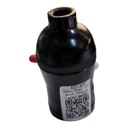 A black plastic push-through socket adapter with a threaded top, a ribbed middle section, a small red protruding tab on the left, a white protruding tab on the right, and a white product label with a QR code.