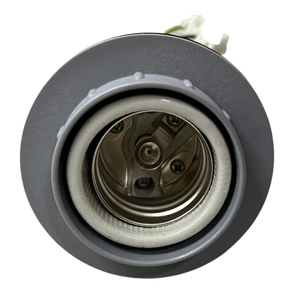 A close-up of a circular gray recessed light fixture showing the interior metal socket and inner ring, with a small white wire visible at the top, on a plain white background.